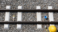 Painting The Sides Of Railroad Rails White To Reduce Derailment